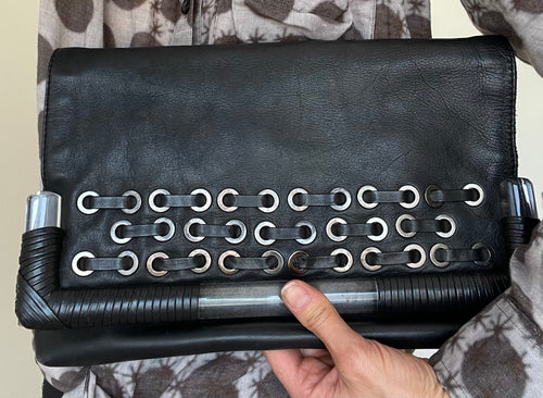 Wayne Cooper Black Leather Clutch – Grommet Detail & Resin Trim
